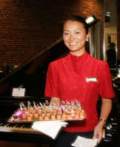 A member of the Cathay Pacific Team presents delectable treats